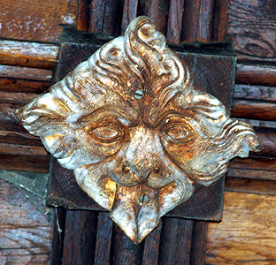 Roof boss of a Green Man in the chancel August 2011